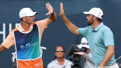 Scottie Scheffler of the United States reacts to his birdie putt on the 17th green with caddie Michael Cromie. (Getty Images via AFP) Scottie Scheffler of the United States reacts to his birdie putt on the 17th green with caddie Michael Cromie. (Getty Images via AFP)