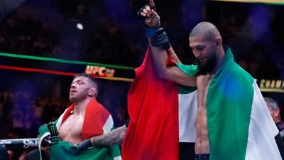 Khamzat Chimaev (blue gloves) reacts after the fight against Dricus Du Plessis Murphy (red gloves) during UFC 319 at United Center. Mandatory Credit: Kamil Krzaczynski-Imagn Images (IMAGN IMAGES via Reuters Connect)
