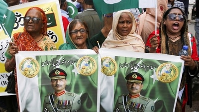 People holding pictures of Field Marshal Asim Munir during a rally in support of Pakistan Army in Karachi. (Reuters file)