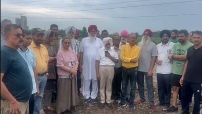 Residents of nearby Sectors 74 and 91 gathered at the plant site to stop construction work. (HT Photo) Residents of nearby Sectors 74 and 91 gathered at the plant site to stop construction work. (HT Photo)