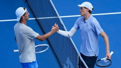 Terence Atmane and Jannik Sinner shake hands at the net after their Cincinnati Masters semifinal. (IMAGN IMAGES via Reuters Connect)