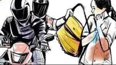 The footage shows the accused initially riding past after failing to grab the purse, only to return seconds later. (HT Photo) The footage shows the accused initially riding past after failing to grab the purse, only to return seconds later. (HT Photo)