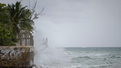 Waves hit a structure as Category 5 Hurricane Erin approaches in San Juan, Puerto Rico, on August 16, 2025. (AFP)