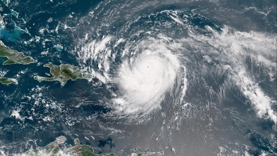 Hurricane Erin has weakened to a Category 3 storm but remains significant, with dangerous surf and rip currents expected along the Florida and East Coast. (Photo by Handout / NOAA / AFP) (AFP) Hurricane Erin has weakened to a Category 3 storm but remains significant, with dangerous surf and rip currents expected along the Florida and East Coast. (Photo by Handout / NOAA / AFP) (AFP)