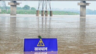 A warning signboard in the Yamuna River near Vasudev Ghat in New Delhi as water levels increase. (Vipin Kumar/Hindustan Times) A warning signboard in the Yamuna River near Vasudev Ghat in New Delhi as water levels increase. (Vipin Kumar/Hindustan Times)