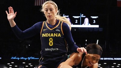Sophie Cunningham was seen clutching her knee, before Fever staff came to her aid, and eventually she walked off. (Getty Images via AFP) Sophie Cunningham was seen clutching her knee, before Fever staff came to her aid, and eventually she walked off. (Getty Images via AFP)