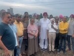 Residents of nearby Sectors 74 and 91 gathered at the plant site to stop construction work. (HT Photo) Residents of nearby Sectors 74 and 91 gathered at the plant site to stop construction work. (HT Photo)