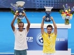 Rajeev Ram (L) and Nikola Mektic pose with the Rookwood Cups after winning the men's doubles during Day 11 of the Cincinnati Open Rajeev Ram (L) and Nikola Mektic pose with the Rookwood Cups after winning the men's doubles during Day 11 of the Cincinnati Open