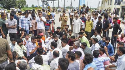Meerut: People stage a protest near Bhuni toll plaza after an Indian Army jawan was allegedly assaulted by the toll plaza employees, in Meerut district. (PTI)