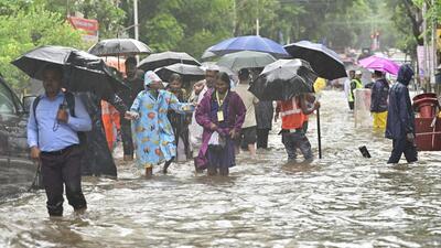Mumbai, India - Aug. 18, 2025:School children make their way through water logged on Tilak Rd, near Khodadad Cricle at Dadar TT, in Mumbai, India, on Monday, August 18, 2025. (Photo by Anshuman Poyrekar/ Hindustan Times) (Hindustan Times) Mumbai, India - Aug. 18, 2025:School children make their way through water logged on Tilak Rd, near Khodadad Cricle at Dadar TT, in Mumbai, India, on Monday, August 18, 2025. (Photo by Anshuman Poyrekar/ Hindustan Times) (Hindustan Times)