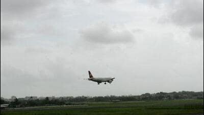 Mumbai Airport - Aeroplane - Aircraft - Flights - A aircraft takes the newly constructed parallel taxiway A4 while an Indian flight takes off. Aircrafts need not back track courtesy the taxiway - HT PHOTO BY VIJAYANAND GUPTA 01-09-07