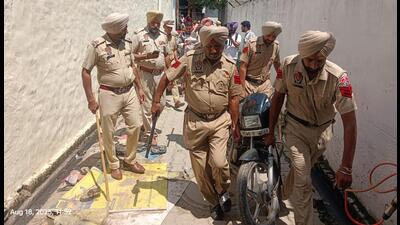 Police seize a bike during the cordon and search operation at Bangala Basti in Kharar on Monday. (HT)