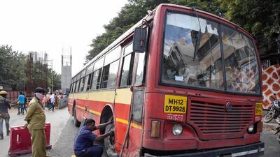Pune, India - September 10, 2018: PMPML workers try to replace the tyre after the bus was punctured by Bharat Band supporters on Paud road near Kinara hotel in Pune, India, on Monday, September 10, 2018. (Photo by Sanket Wankhade/HT PHOTO)