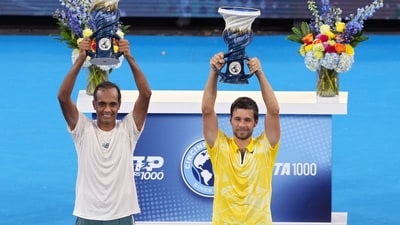 Rajeev Ram (L) and Nikola Mektic pose with the Rookwood Cups after winning the men's doubles during Day 11 of the Cincinnati Open (Getty Images via AFP) Rajeev Ram (L) and Nikola Mektic pose with the Rookwood Cups after winning the men's doubles during Day 11 of the Cincinnati Open (Getty Images via AFP)