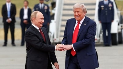 US President Donald Trump shakes hand with Russian President Vladimir Putin (REUTERS)