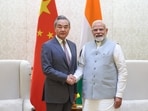 Prime Minister Narendra Modi meets Chinese Foreign Minister Wang Yi during his visit to India, in New Delhi 