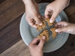 Here’s food for thought: Maybe it’s time brands seasoned their slogans with a pinch of purpose. Perhaps the next garlic bread wrapper could say: Sharing is caring, extra cheese for the brave. (Shutterstock)