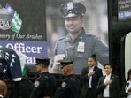 Police officers carry the coffin of New York City Police Department (NYPD) officer Didarul Islam, killed during a mass shooting event at a midtown Manhattan office tower on July 28, in the rain, during his funeral services in the Bronx borough of New York City, U.S., July 31, 2025 REUTERS/Jeenah Moon