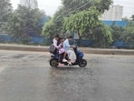 Commuters on their way near Noida sector-51 as heavy rain hits the National Capital Region. Commuters on their way near Noida sector-51 as heavy rain hits the National Capital Region.