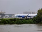 An IndiGo aircraft stationed at Chhatrapati Shivaji Maharaj International Airport amid the rising water level of the nearby Mithi River due to heavy rainfall, at Kurla, in Mumbai, Monday, Aug. 18, 2025. 