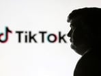 A 3D-printed miniature model of Donald Trump and TikTok logo are seen in this illustration