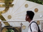 "The rupee's measured response to the new tariffs likely reflects the Reserve Bank of India's (RBI) resolve to prevent a breach of the all-time low of 87.95," says a trader.