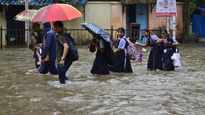 School students make their way through water logged on Tilak Rd, near Khodadad Cricle at Dadar TT, in Mumbai. (Anshuman Poyrekar/HT Photo) School students make their way through water logged on Tilak Rd, near Khodadad Cricle at Dadar TT, in Mumbai. (Anshuman Poyrekar/HT Photo)