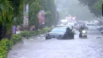 A video from Mumbai's Andheri West shows a Mercedes on a waterlogged road. (ANI) A video from Mumbai's Andheri West shows a Mercedes on a waterlogged road. (ANI)