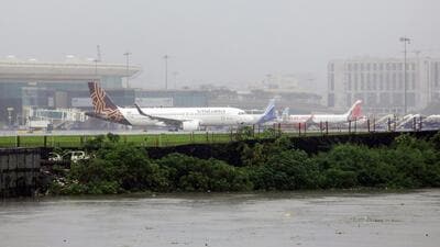 The Mithi River experiences elevated water levels near the airport in Kurla, in Mumbai on Monday. (ANI)