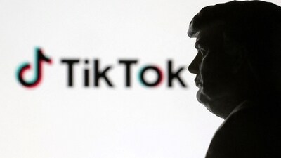 A 3D-printed miniature model of Donald Trump and TikTok logo are seen in this illustration (REUTERS)