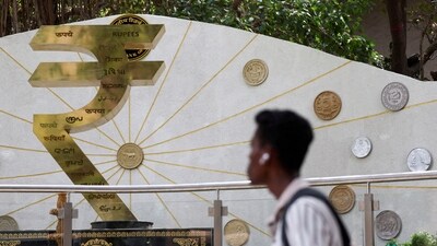 "The rupee's measured response to the new tariffs likely reflects the Reserve Bank of India's (RBI) resolve to prevent a breach of the all-time low of 87.95," says a trader. (Reuters)