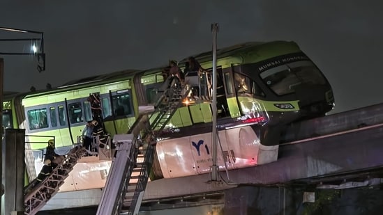Truck-mounted scissor lifts, cranes, and ladders were deployed to resue passengers stuck in the monorail. (HT/Raju Shinde)