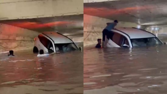 A flooded Thane underpass left an SUV stranded. (@Brezzy_Drive/X)