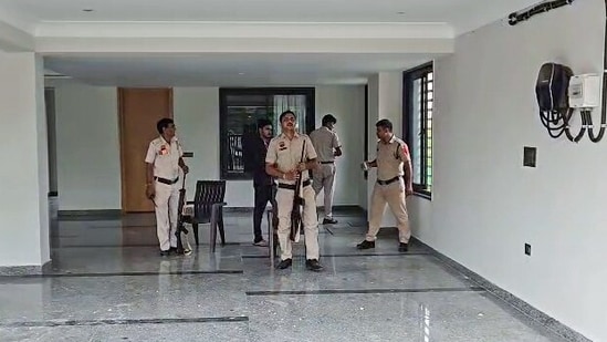 Teams of Gurugram Police at the spot after a firing incident at Elvish Yadav's residence, in Gurugram on Sunday (ANI Grab)