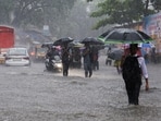 Mumbai: Commuters make way through a waterlogged road amid rainfall, in Mumbai, Tuesday, Aug. 19, 2025. (PTI Photo)(PTI08_19_2025_000449B) Mumbai: Commuters make way through a waterlogged road amid rainfall, in Mumbai, Tuesday, Aug. 19, 2025. (PTI Photo)(PTI08_19_2025_000449B)