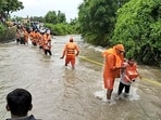 The NDRF also evacuated 12 persons trapped in low-lying areas at Manewada village in Junagadh. The NDRF also evacuated 12 persons trapped in low-lying areas at Manewada village in Junagadh.