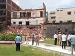 The cause of the collapse of the three-storey building is not yet know. Rescue efforts are underway. The cause of the collapse of the three-storey building is not yet know. Rescue efforts are underway.