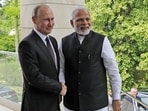 File photo: Russian President Vladimir Putin and Prime Minister Narendra Modi pose for a photo during their meeting in Russia. 
