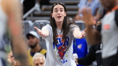 Caitlin Clark #22 of the Indiana Fever reacts during the first quarter against the Dallas Wings at Gainbridge Fieldhouse (Getty Images via AFP) Caitlin Clark #22 of the Indiana Fever reacts during the first quarter against the Dallas Wings at Gainbridge Fieldhouse (Getty Images via AFP)