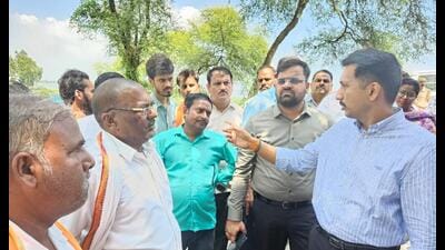 District magistrate Vishak G interacting with residents of affected areas in BKT. (HT)