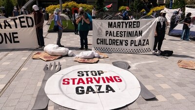 A "Stop Starving Gaza" sign during a protest at the Microsoft Campus in Redmond, Washington as employees rallied at the company to increase pressure on the software maker to stop doing business with Israel. (Bloomberg) A "Stop Starving Gaza" sign during a protest at the Microsoft Campus in Redmond, Washington as employees rallied at the company to increase pressure on the software maker to stop doing business with Israel. (Bloomberg)