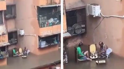 The Mumbai men set up a table and chairs on a flooded road. (X/@MithilaWaala) The Mumbai men set up a table and chairs on a flooded road. (X/@MithilaWaala)