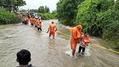 The NDRF also evacuated 12 persons trapped in low-lying areas at Manewada village in Junagadh. (PTI)