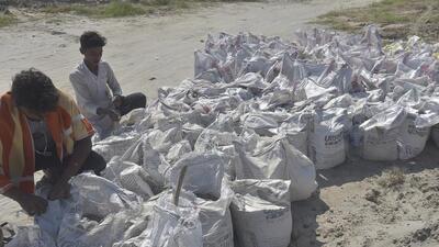 Workers at Subhanpur putting up additional sandbags to protect the Alipur embankment which suffered a major breach at the site during floods in 2023 in Ghaziabad , on Wednesday.