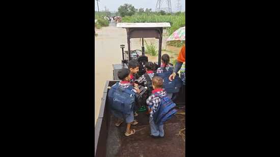Heavy rain on Wednesday left large parts of the city waterlogged, affecting traffic movements, leading to long jams on potholed roads. (HT Photo)