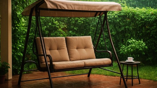 A cosy patio swing styled for the monsoon, perfect for sipping tea while enjoying the rhythm of falling rain. (AI generated)