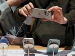 A man checks an iPhone 16 Pro Max as the new iPhone 16 series smartphones go on sale at an Apple store in Beijing, China September 20, 2024. REUTERS//File Photo