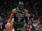 Boston Celtics guard Jaylen Brown (7) dribbles the ball against the San Antonio Spurs during the third quarter at the TD Garden.