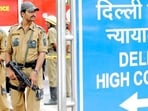 Police commandos stand guard in front of Delhi high court in New Delhi.