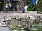 People use there phones in a mess of toppled chairs at the Villanova University campus where an active shooter was reported People use there phones in a mess of toppled chairs at the Villanova University campus where an active shooter was reported